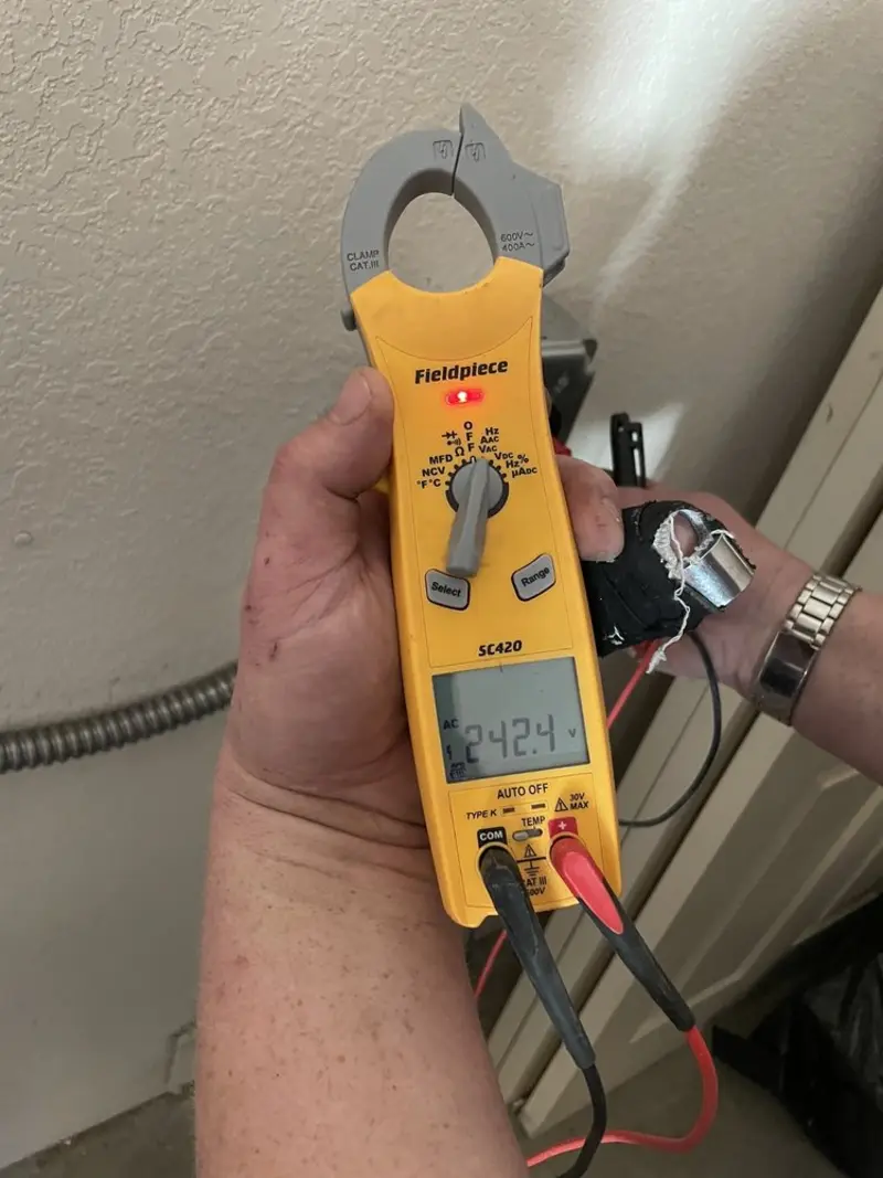 Voltage testing with clamp meter during Outlet Installation in Westchester